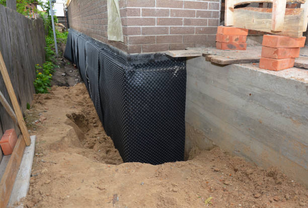 Happy homeowners after waterproofing job in Ithaca